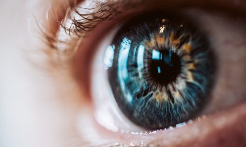 An extreme closeup of an enlarged human eye with beautiful colors